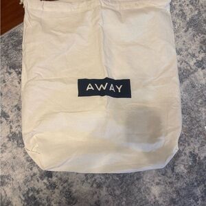Away Suitcase Cream Drawstring Bag